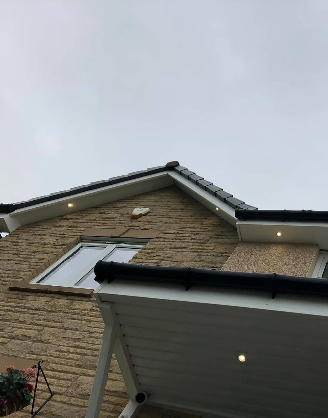A porch canopy with a downlight fitted into its underside